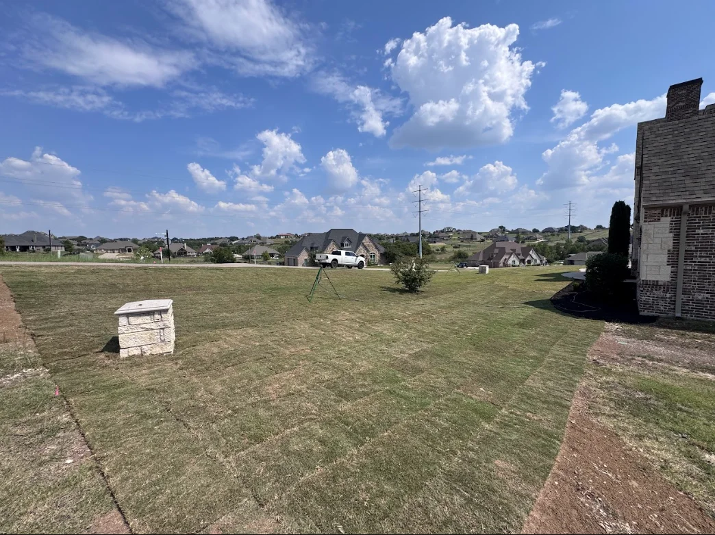 Large residential lot with red clay soil grading and dirt work in Weatherford, TX